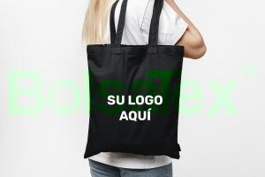 female holding black cotton bag in her hands on wh 2023 11 27 04 59 33 utc min